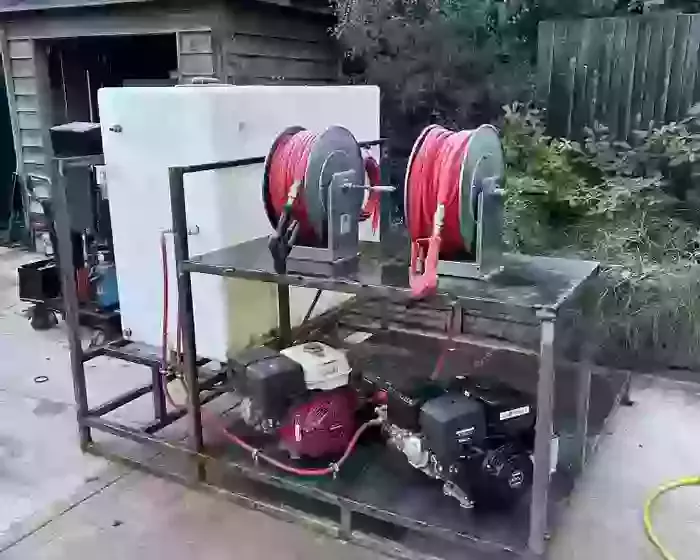 Custom fabricated frame with twin diesel pressure washers and dual hose reels built for a van-mounted off-grid cleaning system in Birmingham.